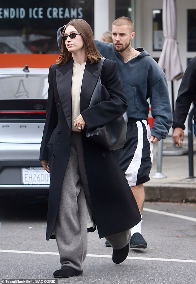104913219-15402775-Justin_and_Hailey_Bieber_looked_sullen_as_they_stepped_out_for_l-a-60_17662768785.avif