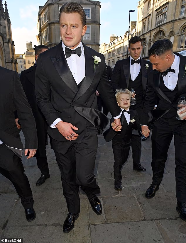 105044835-15415961-Adam_Peaty_has_arrived_at_his_wedding_hand_in_hand_with_his_ador-a-35_17668428961.avif