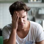 1767160393_0_Young-man-suffering-from-headache-migraine-or-hangover-at-home.jpg