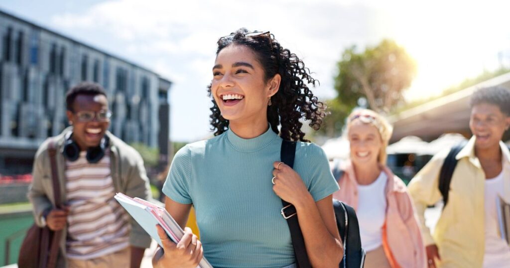 1_Walking-happy-and-girl-with-friends-at-university-for-learning-bonding-and-talking-with-fun-People.jpeg