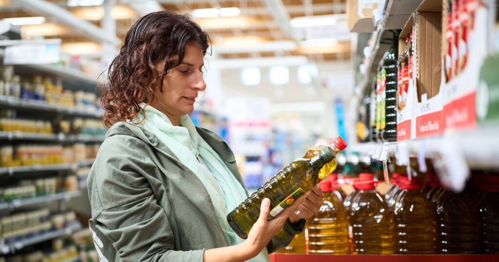1_Woman-shopping-comparing-olive-oil-prices-in-supermarket.jpg