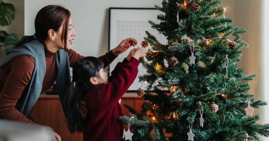 1_Young-Asian-mother-and-lovely-little-daughter-decorating-Christmas-tree-at-home-together-Christmas.jpeg