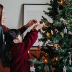 1_Young-Asian-mother-and-lovely-little-daughter-decorating-Christmas-tree-at-home-together-Christmas.jpeg
