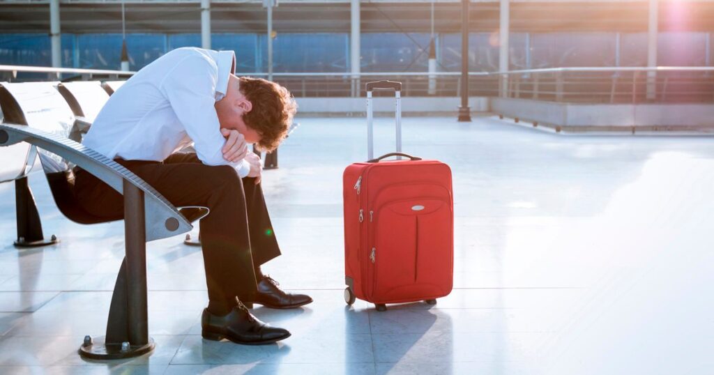 2_Depressed-traveler-waiting-at-airport-flights-delays-and-cancellations.jpg