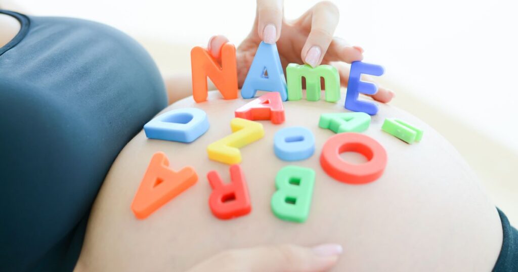 2_expectant-mother-spelling-name-on-her-pregnant-belly.jpg