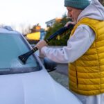 3_Elderly-senior-man-cleans-cars-windshield-from-snow-with-ice-scraper.jpg