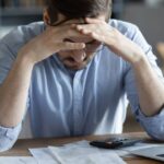 3_Sad-depressed-man-checking-bills-anxiety-about-debt-or-bankruptcy.jpg