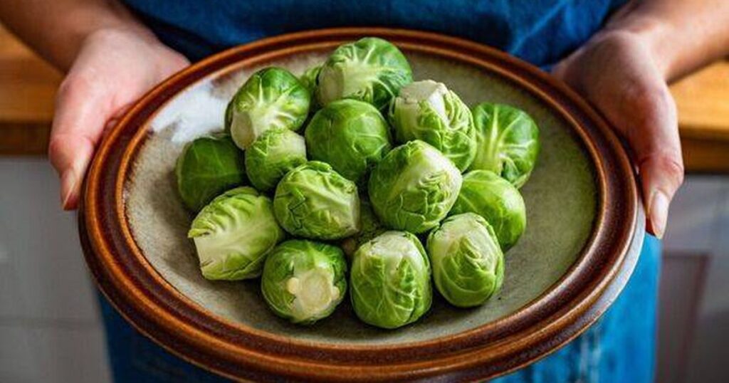 3_Woman-holding-bowl-with-raw-brussels-sprouts.jpg