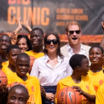 84786731-15401775-Prince_Harry_and_Meghan_at_the_Dream_Big_Basketball_Clinic_in_La-a-1_1766236109313.avif