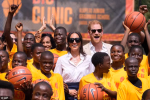 84786731-15401775-Prince_Harry_and_Meghan_at_the_Dream_Big_Basketball_Clinic_in_La-a-1_1766236109313.avif