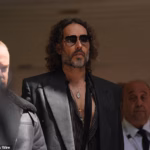 98891479-15409819-Russell_Brand_pictured_leaving_Southwark_Crown_Court_after_he_pl-a-1_1766508382006.avif