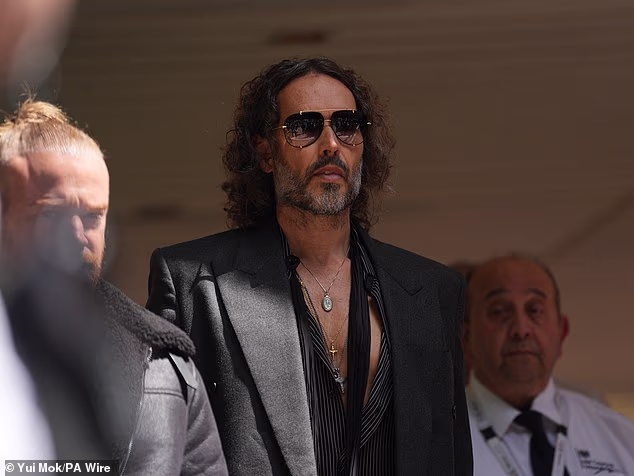 98891479-15409819-Russell_Brand_pictured_leaving_Southwark_Crown_Court_after_he_pl-a-1_1766508382006.avif