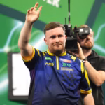 Luke-Littler-acknowledges-the-crowd-following-victory-against-Darius-Labanauskas-on-day-one-of-the-W.avif