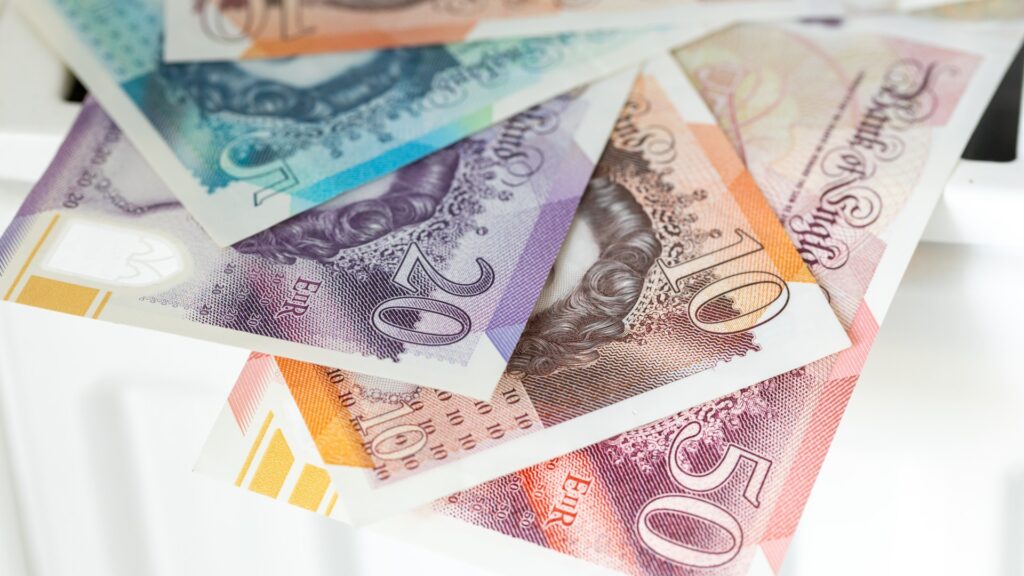 british-pounds-lying-radiator-financial-971727571.jpg
