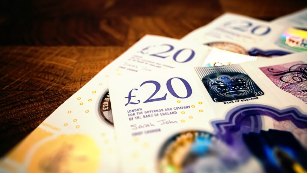 close-twenty-pound-notes-wood-1041527324.jpg
