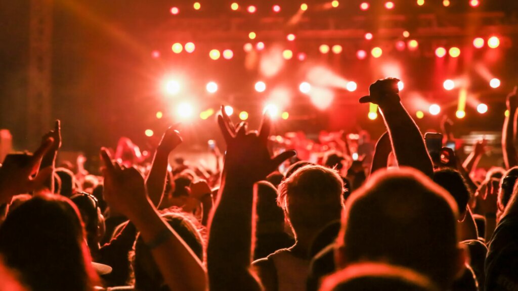 concert-crowd-arms-raised-mosh-1038507009.jpg