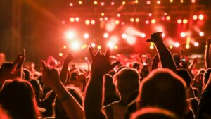 concert-crowd-arms-raised-mosh-1038507009.jpg