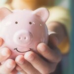 female-hand-holding-piggy-bank-1033071287_7181a7.jpg
