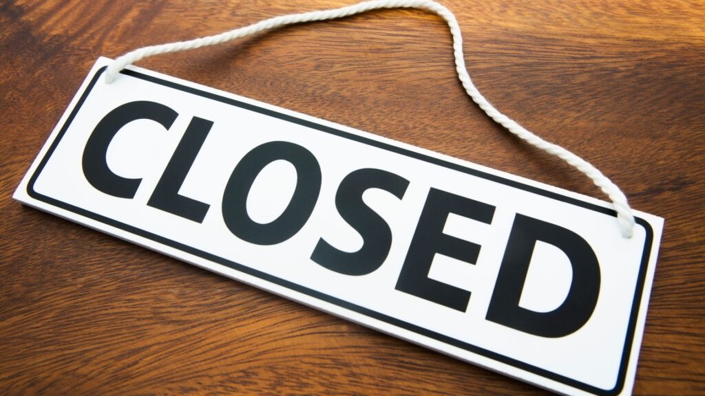 shop-closed-sign-wooden-surface-1047711324.jpg
