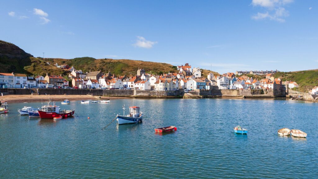 sunny-summer-view-across-harbour-1047681502.jpg