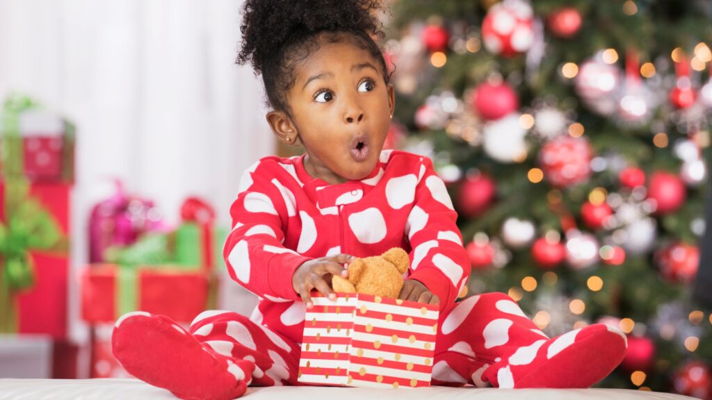 surprised-black-girl-holding-teddy-1043111390_4b780f.jpg