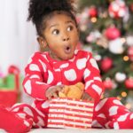 surprised-black-girl-holding-teddy-1043111390_4b780f.jpg
