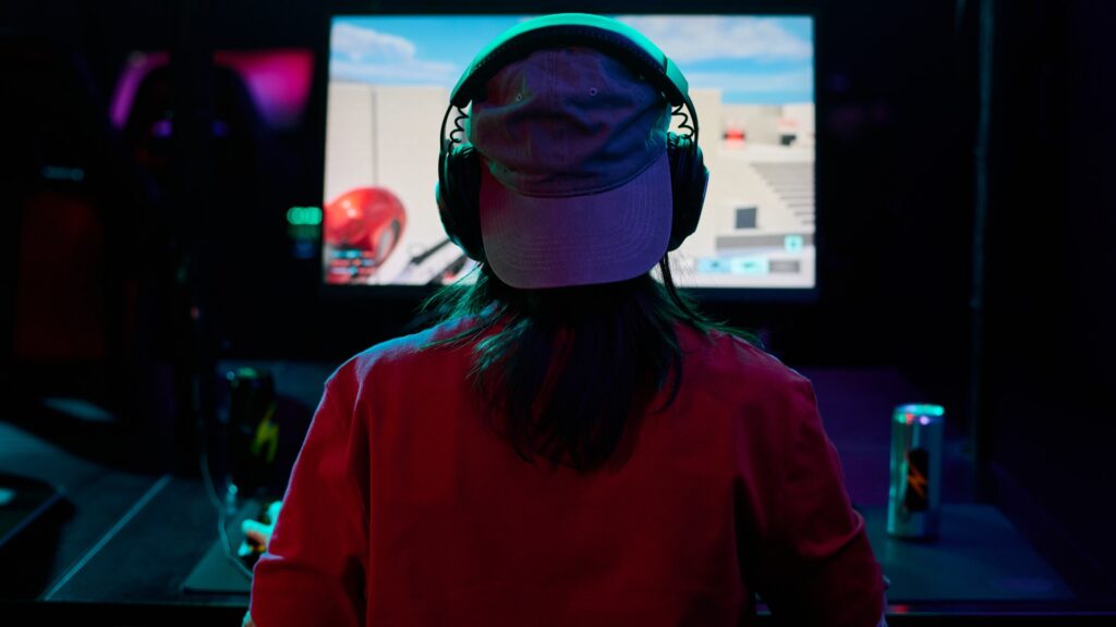 teenage-girl-gamer-wearing-headphones-1047834758.jpg