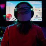 teenage-girl-gamer-wearing-headphones-1047834758.jpg