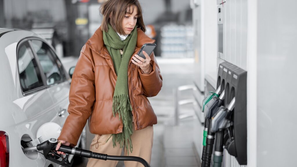 woman-refueling-car-gasoline-using-1047371242.jpg