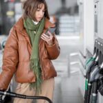 woman-refueling-car-gasoline-using-1047371242.jpg