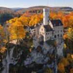 0_Aerial-view-of-Lichtenstein-Castle-on-cliff-surrounded-by-autumn-forest-Germany.jpg