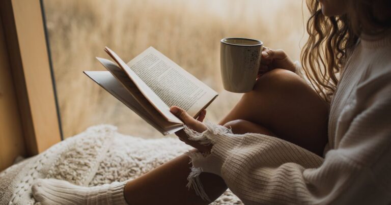 0_Close-up-picture-of-book-and-coffee-cup-in-woman-hands-Autumn-mood-cosiness-and-comfort-concept.jp_.jpeg