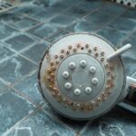 0_Dirty-chrome-shower-head-with-limescale-that-should-be-cleaned-and-mold-on-tiles-Calcified-shower.jpeg
