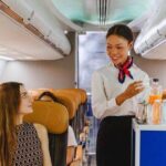 0_Flight-attendant-offering-inflight-refreshments-to-a-seated-passenger-with-a-smile-Represents-qual.jpeg