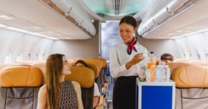 0_Flight-attendant-offering-inflight-refreshments-to-a-seated-passenger-with-a-smile-Represents-qual.jpeg