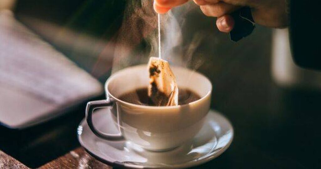 0_Hand-is-picking-a-tea-bag-out-of-a-white-cup.jpg