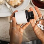 0_Hands-Holding-Pill-Bottle-Over-Table-With-Coffee-Cake-Slice-And-Casual-Morning-Scene.jpg
