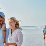 0_Happy-extended-family-strolling-on-the-beach.jpg