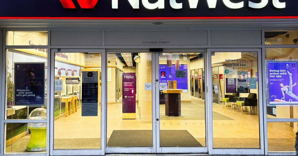0_Modern-NatWest-bank-exterior-with-illuminated-logo-and-glass-entrance-at-night.jpg
