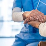 0_Nurse-consoling-a-patient-and-holding-her-hands-at-the-hospital.jpg