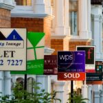 0_Row-of-houses-with-for-sale-signs-in-front-of-them.jpg