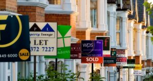 0_Row-of-houses-with-for-sale-signs-in-front-of-them.jpg