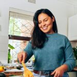 0_Shot-of-a-young-woman-stirring-vegetables-on-the-stove.jpg