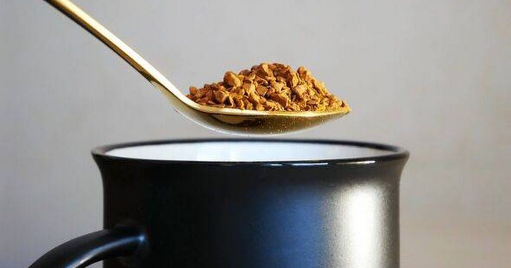 0_Some-freeze-dried-coffee-on-a-golden-teaspoon-above-a-black-cup.jpg