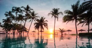 0_Tropical-pool-and-beach-at-sunset.jpg