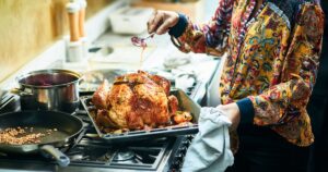 0_Woman-basting-turkey-in-roasting-tin-for-Christmas-dinner.jpg