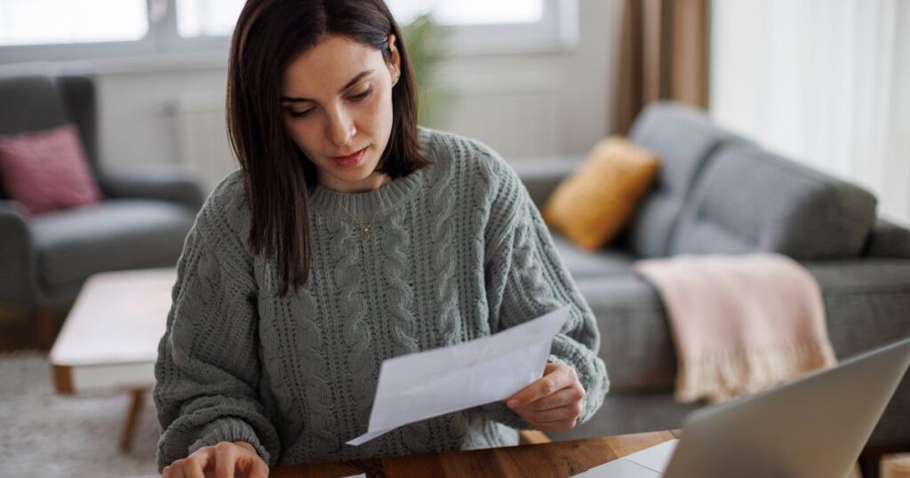 0_Woman-checking-her-monthly-expenses-and-statements-at-home.jpg