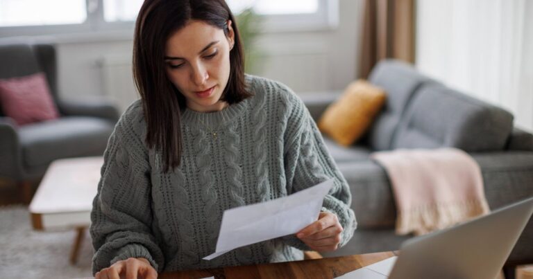 0_Woman-checking-her-monthly-expenses-and-statements-at-home.jpg