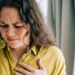 0_Woman-suffering-from-chest-pain-holding-hand-over-heart.jpg