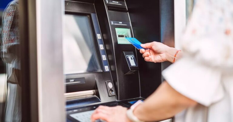 0_Woman-using-ATM-for-cash-withdrawal-with-credit-card.jpg